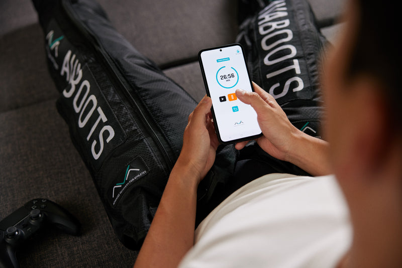 Instructional video demonstrating how to use AVABOOTS compression boots, showing step-by-step how to put them on, adjust intensity levels, and use them correctly for muscle recovery.